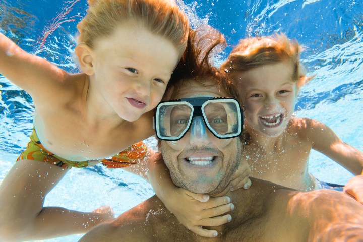 Dad and sons fun underwater selfie while snorkeling in Key Largo